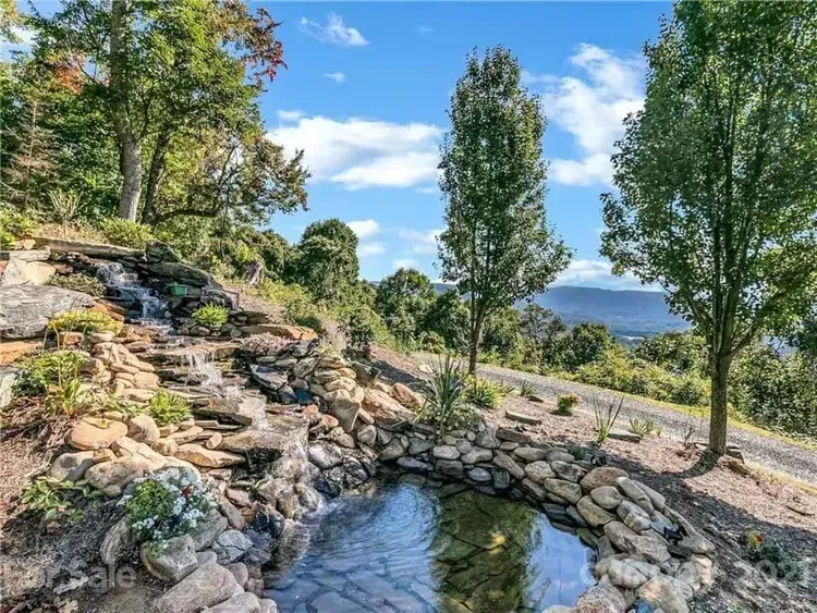 Garden pond and mountain landscape at The Redstone Estate